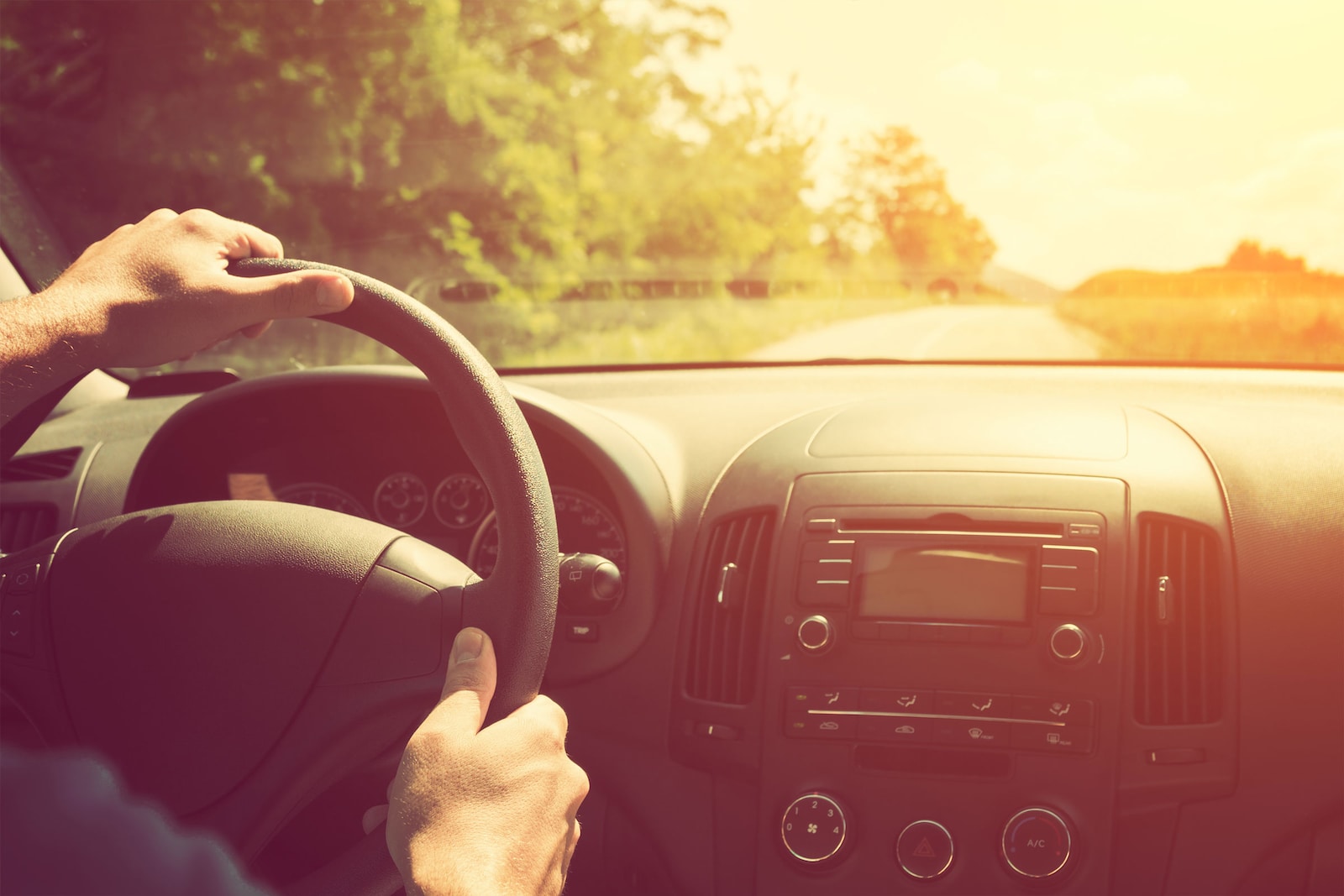 Image of a person at the wheel.