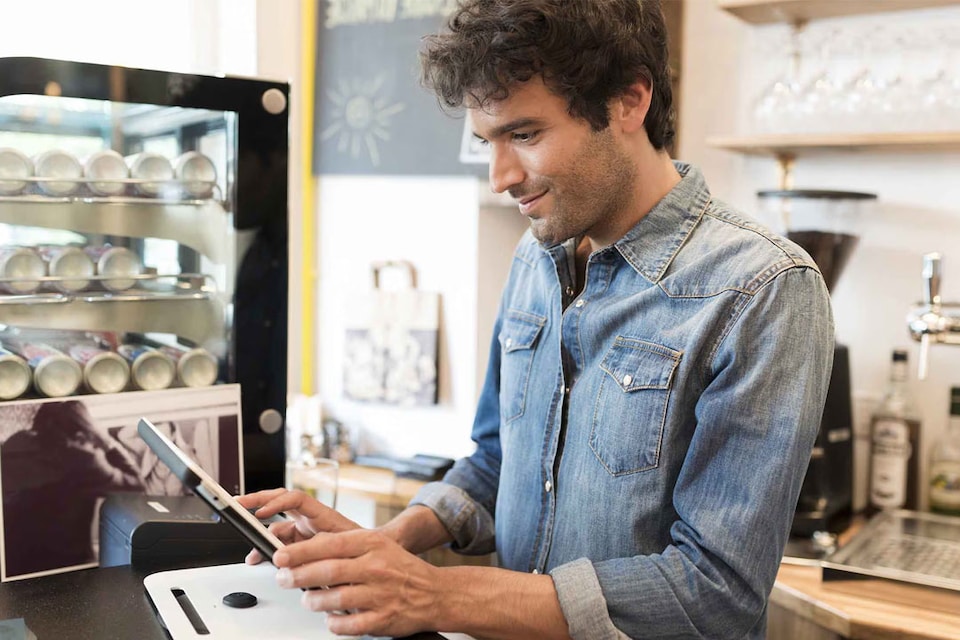 Business owner manages his business from the point of sale with Smart Business