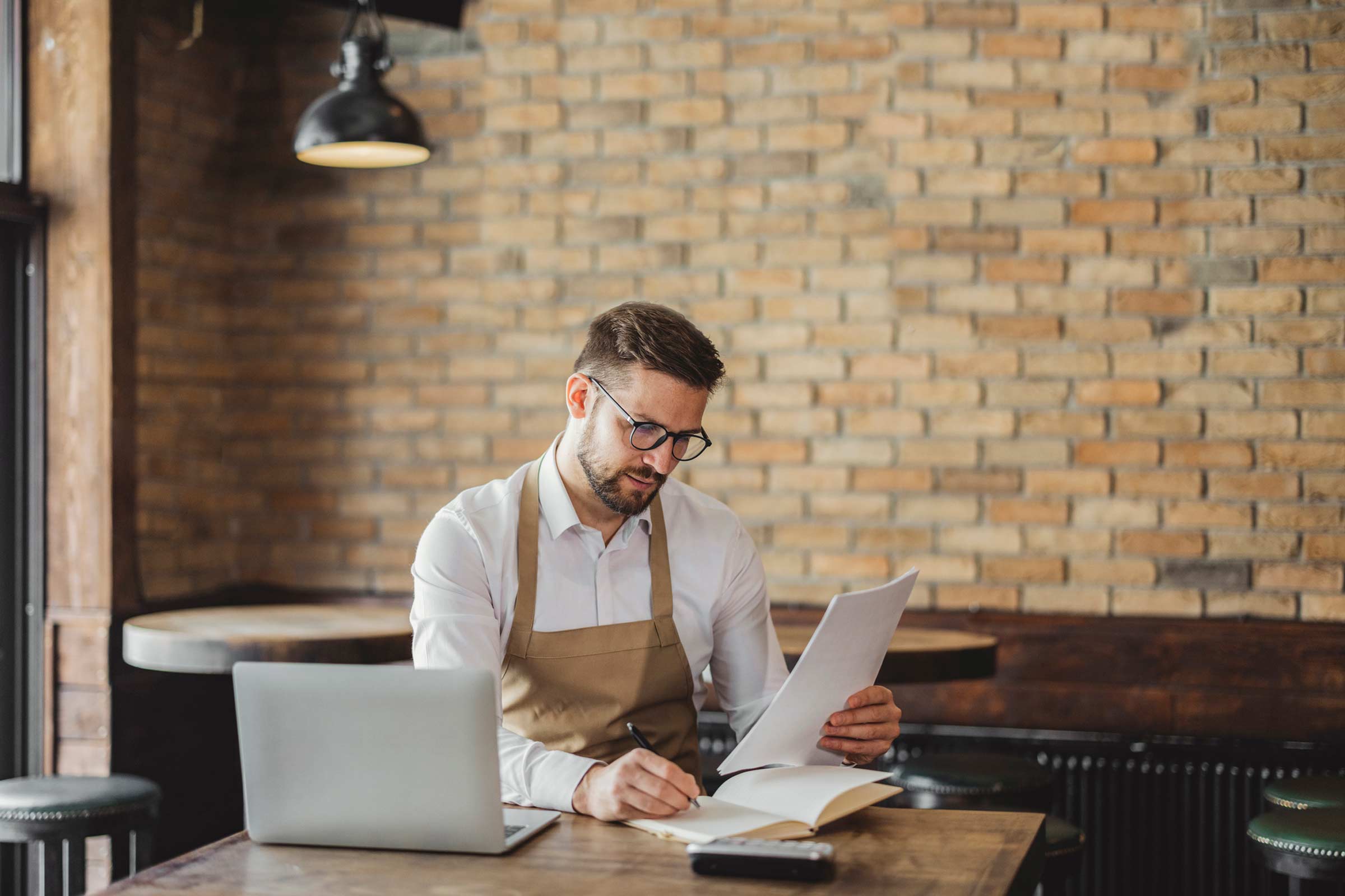 man sitting doing accounts