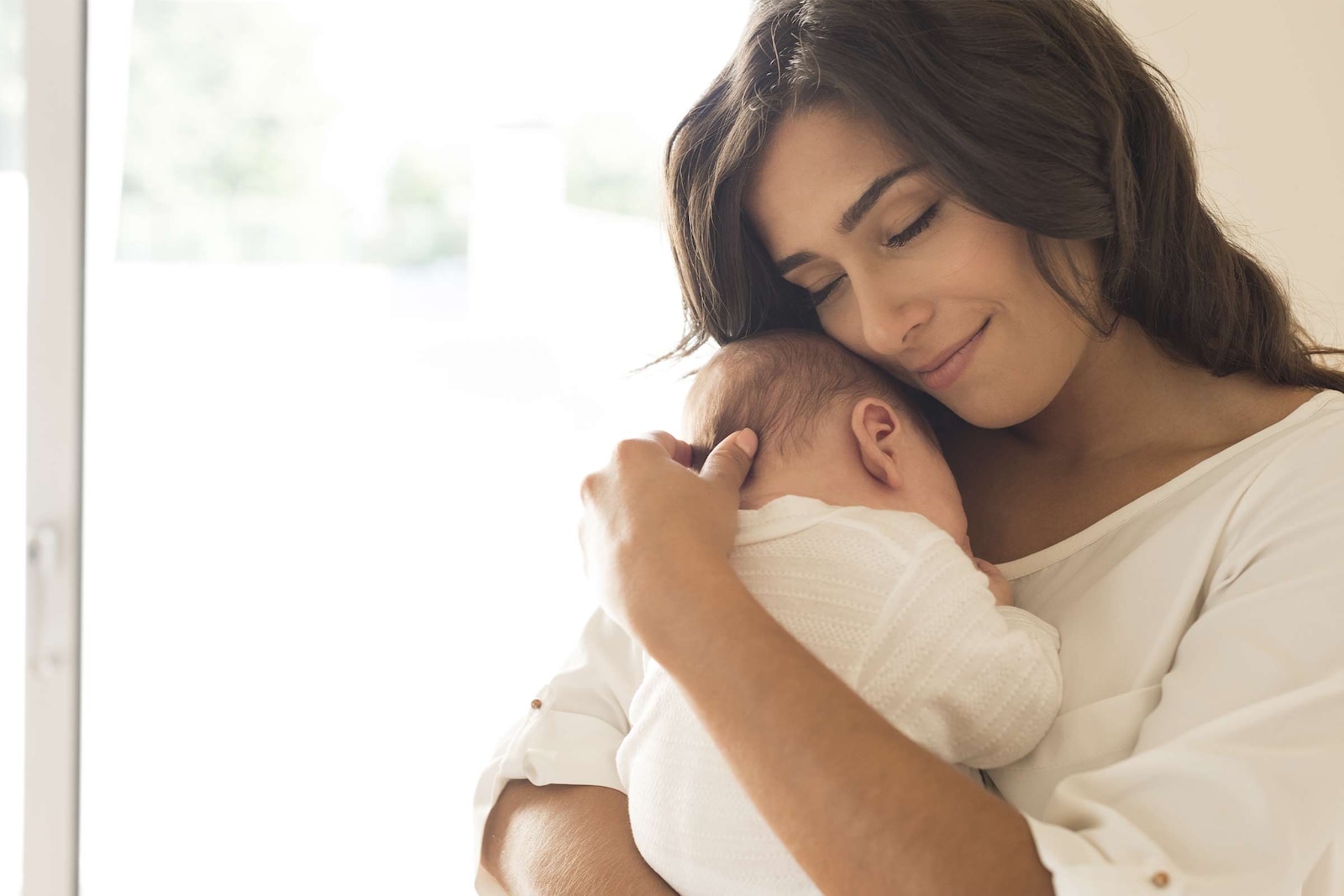 Mother holding her young child