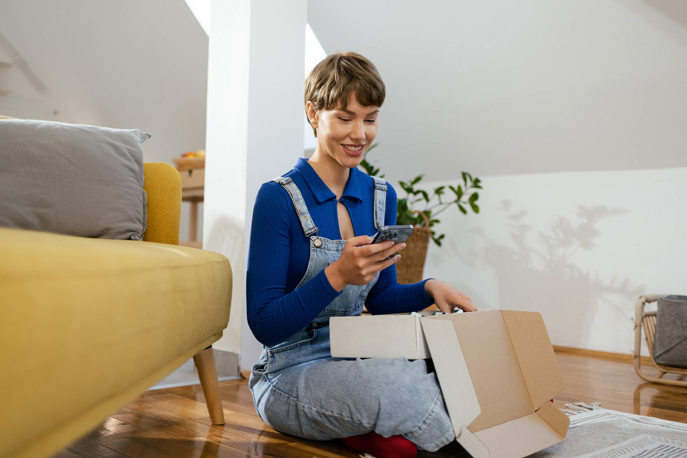 Woman browsing on her mobile after shopping